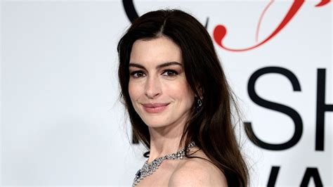 Anne Hathaway shows underboob in tiny string bikini